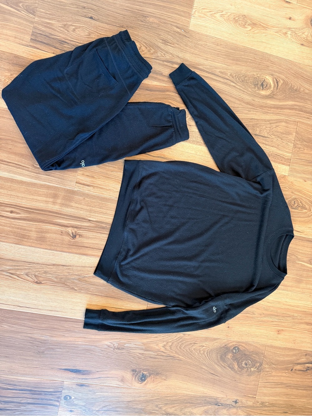 Black ALO loungewear. Crew neck and pair of joggers